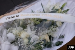 This photograph shows flowers for Ukrainian journalist Victoria Roshchyna, who was captured while reporting from occupied east Ukraine, and died in Russian detention, taken during a protest by Reporters Without Borders in Paris on Feb. 20, 2025.