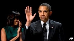 Presiden Obama dan Ibu Negara Michelle Obama menghadiri acara tahunan sarapan dan doa nasional di Washington, Kamis (7/2). 