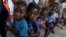 Children line up for food at a shelter for families displaced by gang violence in the Tabarre neighborhood of Port-au-Prince, Haiti, on May 19, 2024. UNICEF this week warned that violence, mass displacement, epidemics and malnutrition are breaking Haiti's health care system.