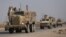 FILE - U.S. military vehicles drive in Hasaka, Syria, Dec. 6, 2024.