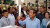 FILE - Cambodian Prime Minister Hun Se looks his ballot at a polling station in Takhmua, Kandal province, southeast of Phnom Penh, Cambodia, Sunday, July 29, 2018. 