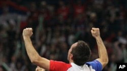 Viktor Troicki of Serbia celebrates after the Serbian national tennis team won the Davis Cup finals against France in Belgrade, Serbia, Sunday, Dec. 5, 2010.