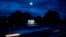 A car passes by Facebook's corporate headquarters location in Menlo Park, California, on March 21, 2018. 