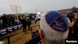 Guests gather for the National Menorah lighting ceremony to mark the start of Hanukkah on the Ellipse near the White House in Washington, Dec. 2, 2018.