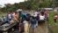FILE - People transport the coffins of two indigenous people killed in Tacueyo, southwest Colombia, Oct. 31, 2019.