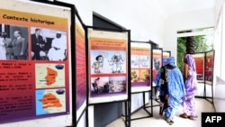 FILE - Visitors view an exhibition depicting the years under which Chad was ruled by dictator Hissene Habre, on July 15, 2015 at the Douta Secke Cultural Center in Dakar. 