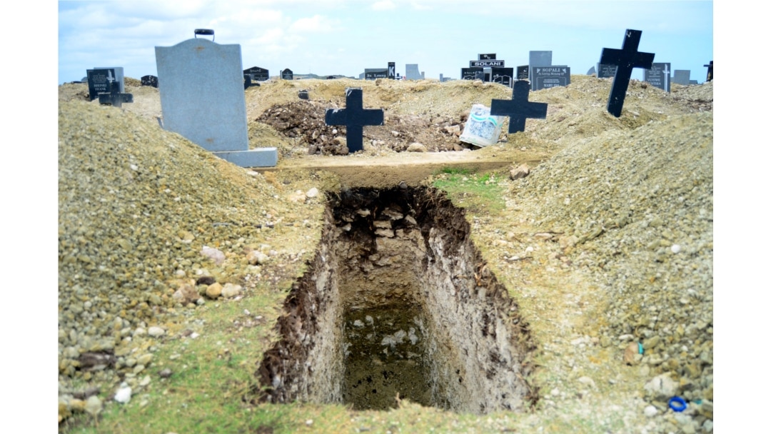 FILE - A freshly-dug grave sits at the Motherwell Cemetery in Port Elizabeth, South Africa, Dec. 4, 2020.