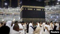 Muslim pilgrims pray around the holy Kaaba at the Grand Mosque on the first day of Eid al-Adha during the annual hajj pilgrimage in Mecca, Sept. 24, 2015.