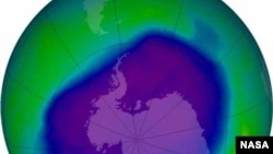 FILE - The ozone hole is shown in September 2006, with the blue and green areas signifying the least ozone.