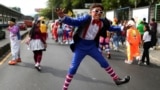 Salvadoran clowns participate in a parade during National Clown Day celebration in San Salvador, El Salvador, Dec. 4, 2024. 