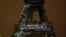 FILE - Artwork entitled 'One Heart One Tree' by artist Naziha Mestaoui is displayed on the Eiffel tower ahead of the 2015 Paris Climate Conference, in Paris. The Paris Agreement on climate change came into force Nov. 4, 2016.