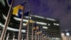 European Union and Ukrainian flags flap in the wind on the day to mark the third anniversary of Russia's full-scale invasion of Ukraine, at EU headquarters in Brussels, Feb. 24, 2025.