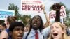 Supporters of the Affordable Healthcare Act celebrate in front of the Supreme Court after the court upheld the legality of the law in Washington June 28, 2012. A sharply divided U.S. Supreme Court on Thursday upheld the centerpiece of President Barack Oba