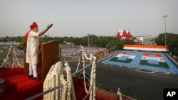 Indian Prime Minister Narendra Modi, addresses the nation from the ramparts of Red Fort to celebrate Independence Day in New Delhi, India, Friday, Aug. 15, 2014.