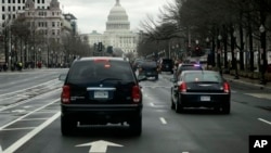 President Obama's motorcade travels down Pennsylvania Avenue toward the Capitol, Washington, D.C., March 12, 2013.