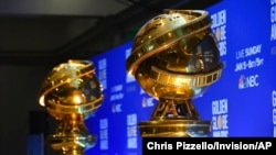 FILE - Replicas of Golden Globe statues are seen at the nominations for the 77th annual Golden Globe Awards in Beverly Hills, Calif., Dec. 9, 2019.