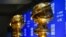 FILE - Replicas of Golden Globe statues are seen at the nominations for the 77th annual Golden Globe Awards in Beverly Hills, Calif., Dec. 9, 2019.