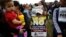 File -- Opponents to the peace deal signed between the Colombia government and rebels of the Revolutionary Armed Forces of Colombia promote the "No" vote in Oct. 1, 2016, referendum in Bogota, Colombia. Colombians narrowly rejected the deal. 