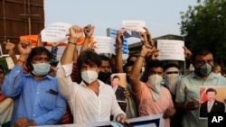 Indians shout slogans against China during a protest in Ahmedabad, India, June 16, 2020.