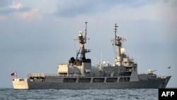 FILE - A Philippines Navy ship is anchored before a multilateral naval exercise at Denpasar, in Indonesia's Bali island on Feb. 15, 2025. The Philippines has detected foreign attempts to access intelligence data. 