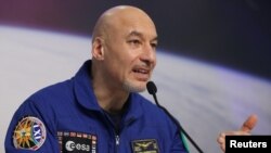 Italian ESA astronaut Luca Parmitano addresses a news conference after returning from commanding the International Space Station mission at the European Space Agency (ESA) training center in Wahn, Germany, Feb. 8, 2020.