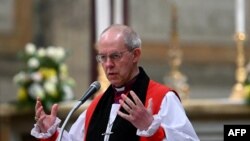 FILE — The archibishop of Canterbury Justin Welby presides over the celebration of vespers, on the solemnity of the conversion of Saint Paul, in the Basilica of St. Paul Outside The Walls in Rome on January 25, 2024. 