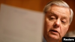 FILE - Chairman Sen. Lindsay Graham (R-SC) reads a letter on Capitol Hill in Washington, March 15, 2017. 