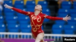 FILE - Wu Liufang, who is about to turn 30, started practicing gymnastics at age 4. She was selected for the national team in 2008 and won a total of 15 gold medals and 16 silver medals in multiple international competitions.