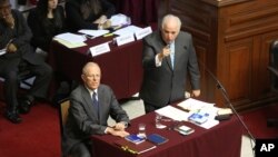 Peru's President Pedro Pablo Kuczynski listens as his lawyer Alberto Borea addresses lawmakers of the opposition-ruled Congress, in Lima, Peru Dec. 21, 2017.