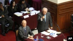 Peru's President Pedro Pablo Kuczynski listens as his lawyer Alberto Borea addresses lawmakers of the opposition-ruled Congress, in Lima, Peru, Dec. 21, 2017. 