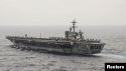 The aircraft carrier USS Theodore Roosevelt (CVN 71) transits the South China Sea in this U.S. Navy picture taken Oct. 29, 2015. U.S. Secretary of Defense Ash Carter will visit the Roosevelt as it transits the South China Sea on Thursday.