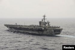 The aircraft carrier USS Theodore Roosevelt (CVN 71) transits the South China Sea in this U.S. Navy picture taken Oct. 29, 2015. U.S. Secretary of Defense Ash Carter will visit the Roosevelt as it transits the South China Sea on Thursday.