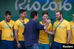 Rio de Janeiro Mayor Eduardo Paes greets Australian athletes during a welcome ceremony he arranged for the delegation at the Olympic village in Rio de Janeiro, Brazil, July 27, 2016.