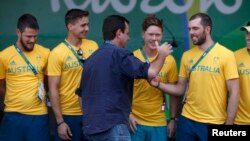 Rio de Janeiro Mayor Eduardo Paes greets Australian athletes during a welcome ceremony he arranged for the delegation at the Olympic village in Rio de Janeiro, Brazil, July 27, 2016. 