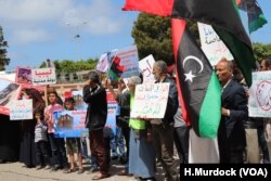 Protesters objecting to foreign contributions to the assault on Tripoli gather outside the Ministry of Foreign Affairs in Tripoli, Libya, April 28, 2019.