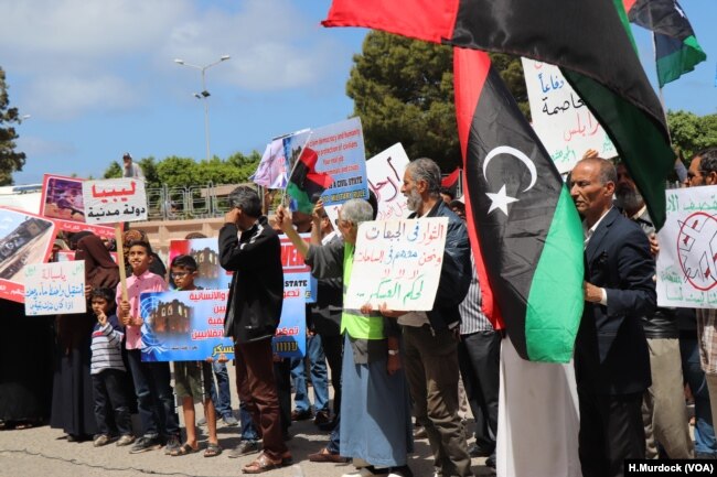 Protesters objecting to foreign contributions to the assault on Tripoli gather outside the Ministry of Foreign Affairs in Tripoli, Libya, April 28, 2019.