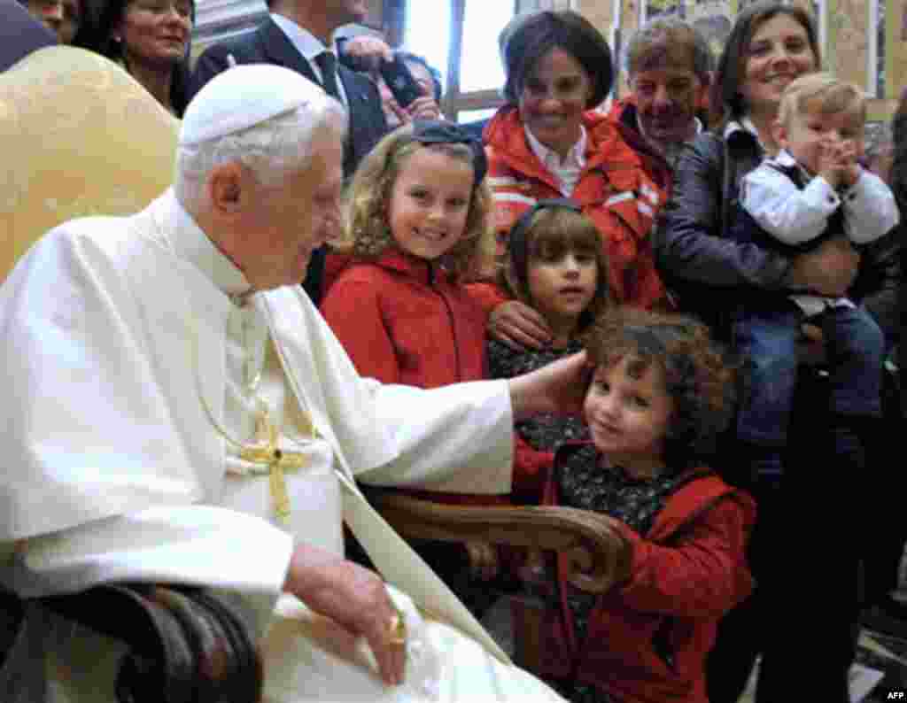 In this picture made available by the Vatican newspaper Osservatore Romano, Pope Benedict XVI greets children during a private audience granted to Italian Ski Masters, at the Vatican, Monday, Nov. 15, 2010. (AP Photo/Osservatore Romano, HO) ** EDITORIAL U