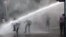 Turkish riot police spray water cannon at demonstrators in Kizilay Square in Ankara, Turkey, June 16, 2013.