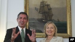 Greek Foreign Minister Stavros Lambrinidis , left, and US Secretary of State Hillary Rodham Clinton speak on Sunday July 17, 2011 during a meeting at the Ministry of Foreign Affairs in Athens