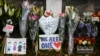 Flowers and signs are seen at a memorial as tributes to victims of the mosque attacks near Linwood mosque in Christchurch, New Zealand, March 16, 2019.