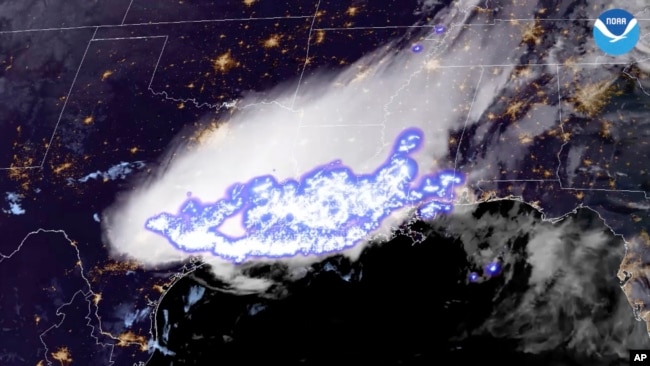 This satellite image provided by the National Oceanic and Atmospheric Administration shows a thunderstorm complex which was found to contain the longest single flash that covered a horizontal distance on record, at around 768 kilometers across parts of the southern United States.
