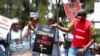 Kenya Corruption: Demonstrators wear mock prison outfits to show that they want to imprison those engaged in corruption, in Nairobi, Kenya, Nov. 3, 2016.