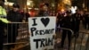 A supporter of President-elect Donald Trump shouts back at opposing demonstrators during a protest against the President-elect in Manhattan, New York, Nov. 11, 2016. 