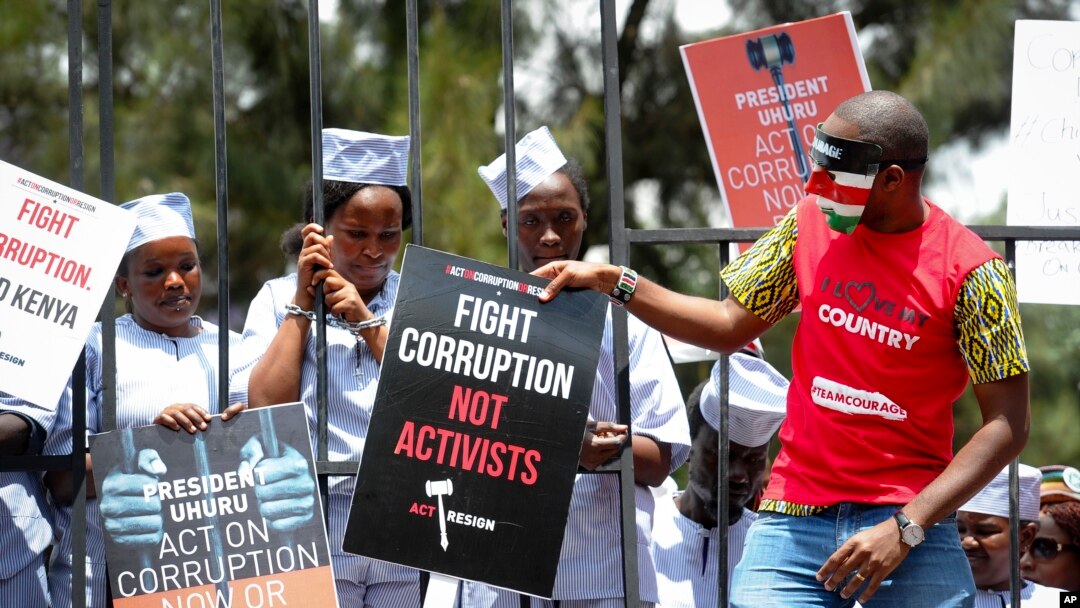 Kenya Corruption: Demonstrators wear mock prison outfits to show that they want to imprison those engaged in corruption, in Nairobi, Kenya, Nov. 3, 2016.