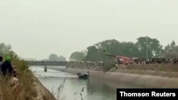 Bus falls into a canal in Sidhi district of India’s northeast Madhya Pradesh state, Feb 16, 2021.