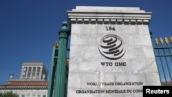 FILE - A logo is pictured on the headquarters of the World Trade Organization in Geneva, Switzerland, June 2, 2020. 