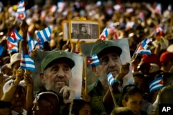People wait for the start of a memorial honoring the late Fidel Castro at Plaza Antonio Maceo in Santiago, Cuba, Dec. 3, 2016.