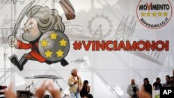 FILE - Beppe Grillo, leader of the Five Stars Movement, delivers his speech during a campaign rally in view of the May 25th EU Parliament elections in Rome, May 23, 2014.