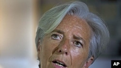 French Finance Minister Christine Lagarde addresses a press conference, in New Delhi, India, Tuesday, June 7, 2011