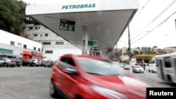 A car departs from a Petrobras gas station in the outskirts of Sao Paulo, Brazil, July 31, 2018. 